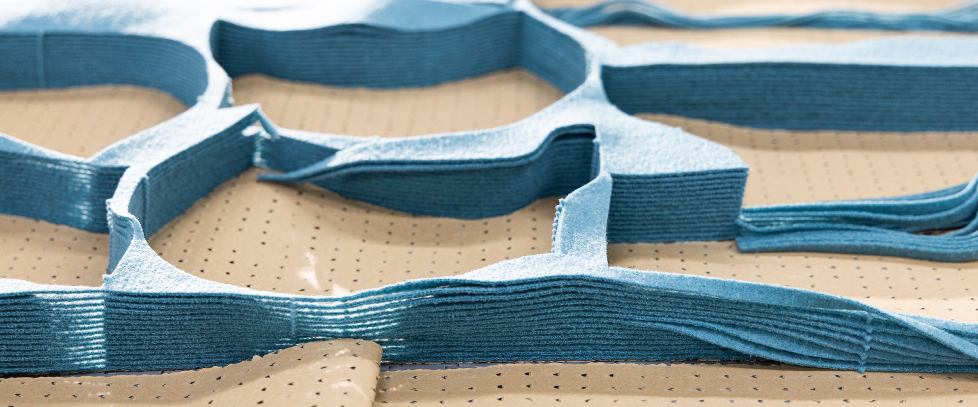 Cut fabric pieces on the cutting table
