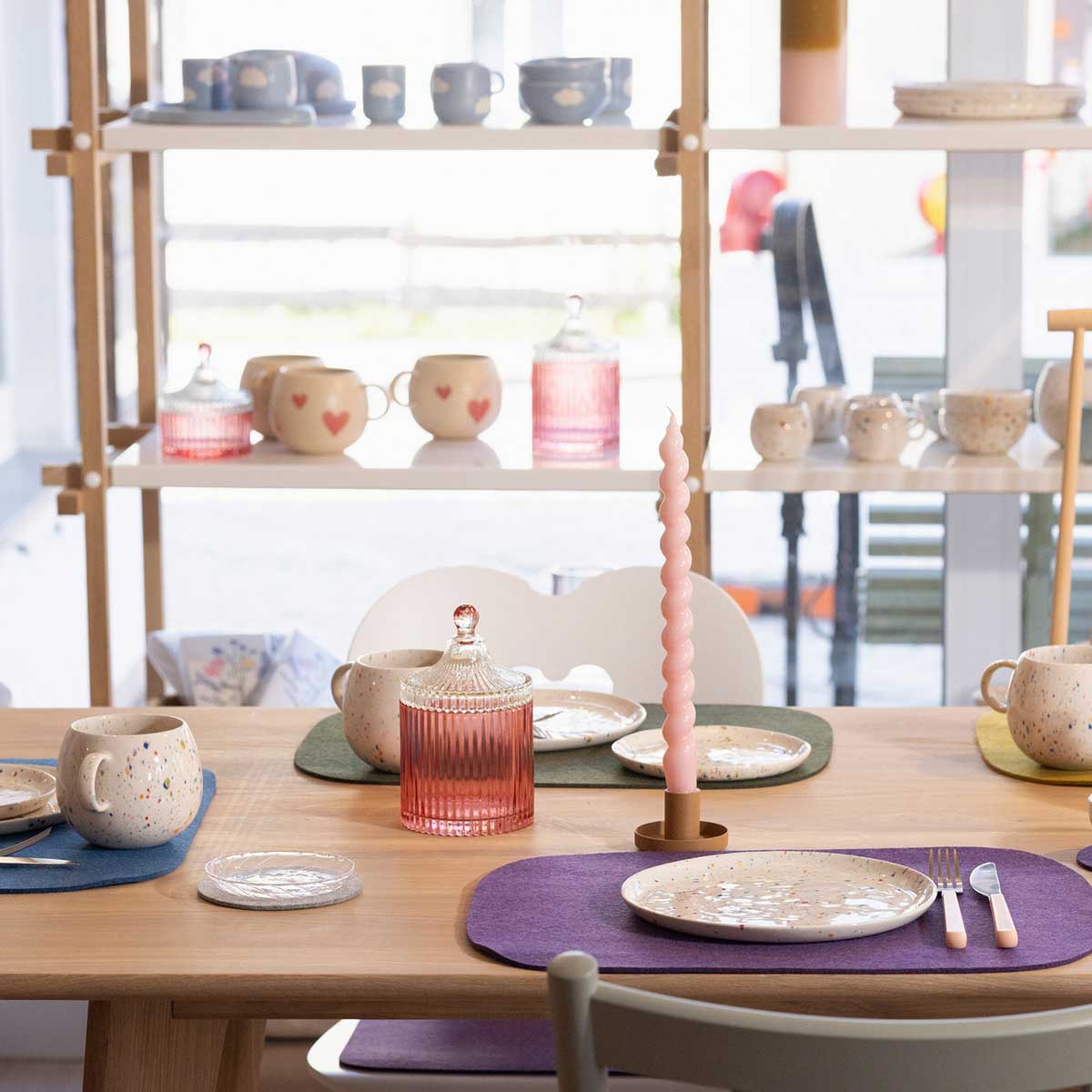 Felt placemats on a laid wooden table